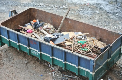 Demolition site in Maida Vale with waste removal trucks